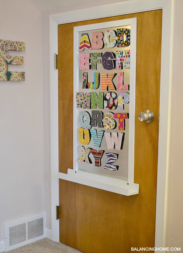 DIY Magnet Board in kids room with fabric magnetic letters from Crunch Baby Farm