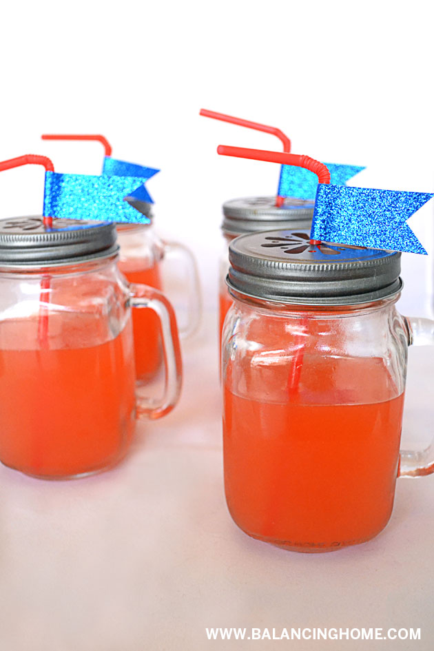 Dress up your mason jar with a flower punch lid and glitter tape.